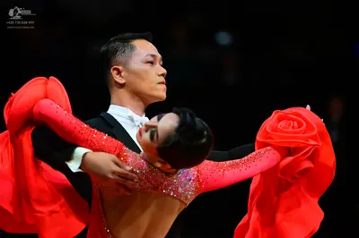 Dancesport competitor: Male dancer: black suit with a white shirt