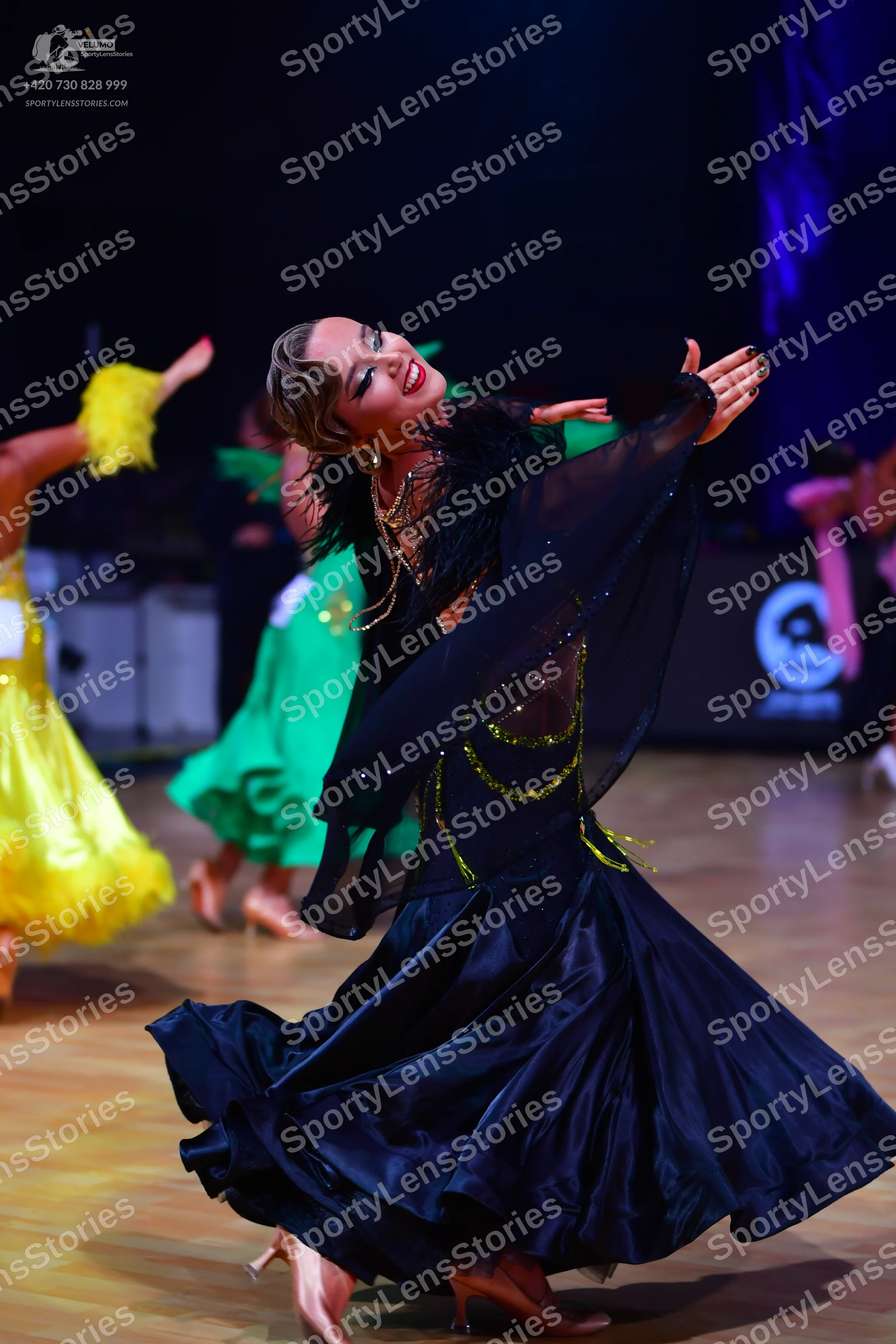 Dancesport competitor: Main dancer: black ballroom dress with a voluminous satin skirt and a sheer bodi