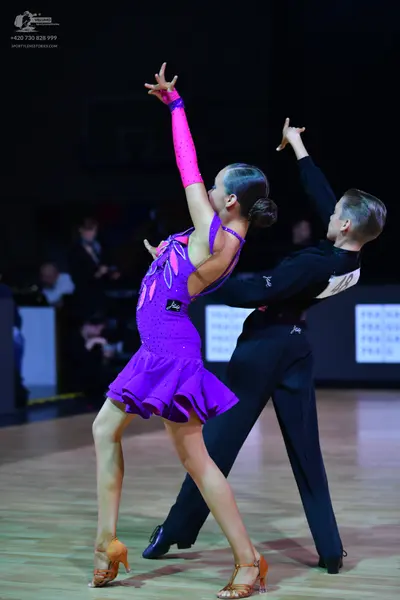 Dancesport competitor: Male dancer: black long-sleeve shirt and black trousers