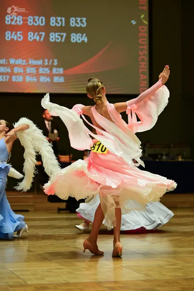 Dancesport competitor #826, #999: ** Light Pink/Peach Latin Dress
*   **Fabric:** Satin with a subtle shimmering e