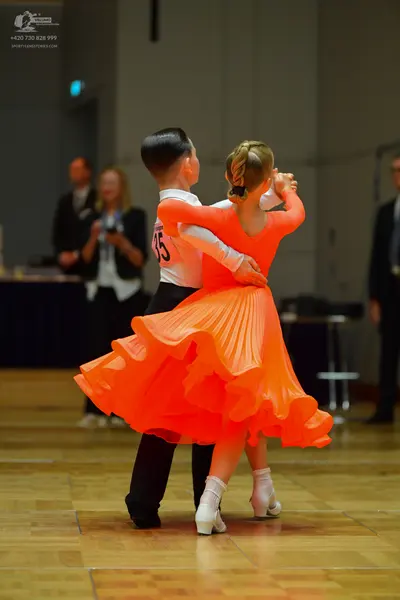 Dancesport competitor #15: Male dancer: white long-sleeved shirt and black trousers