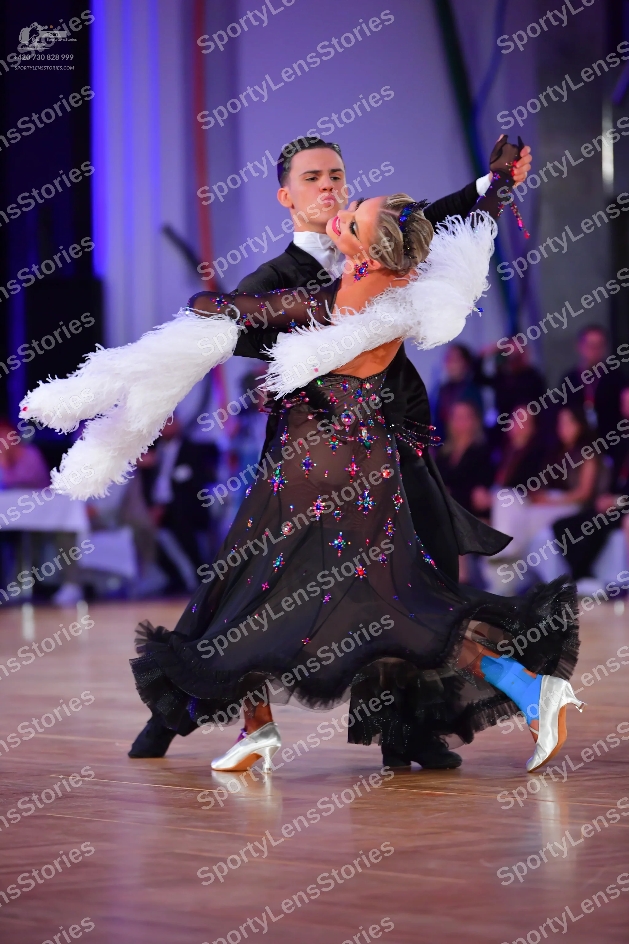 Dancesport competitor: Male dancer: black suit, white shirt, and black bow tie