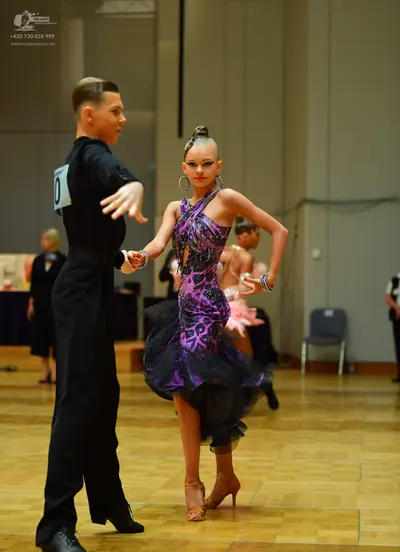 Dancesport competitor: Male dancer: black long-sleeved shirt and black trousers