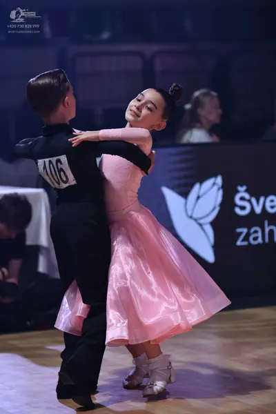 Dancesport competitor: Male dancer: black suit
