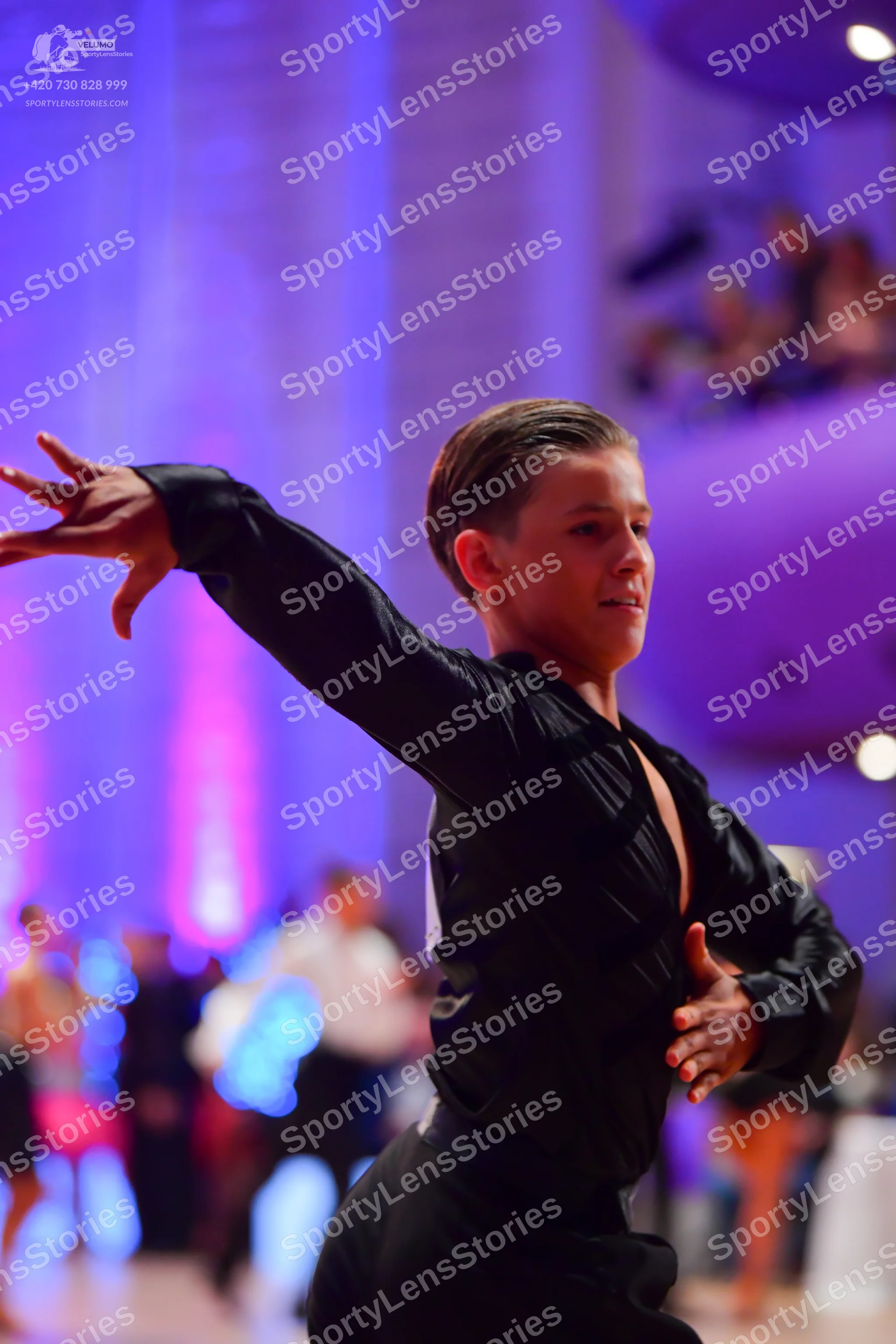 Dancesport competitor: Male dancer: black long-sleeved dance top and black trousers