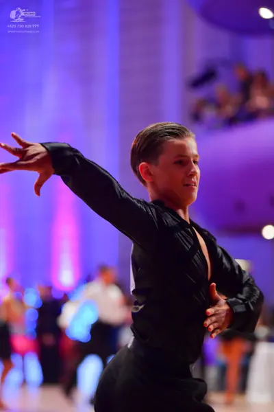 Dancesport competitor: Male dancer: black long-sleeved dance top and black trousers
