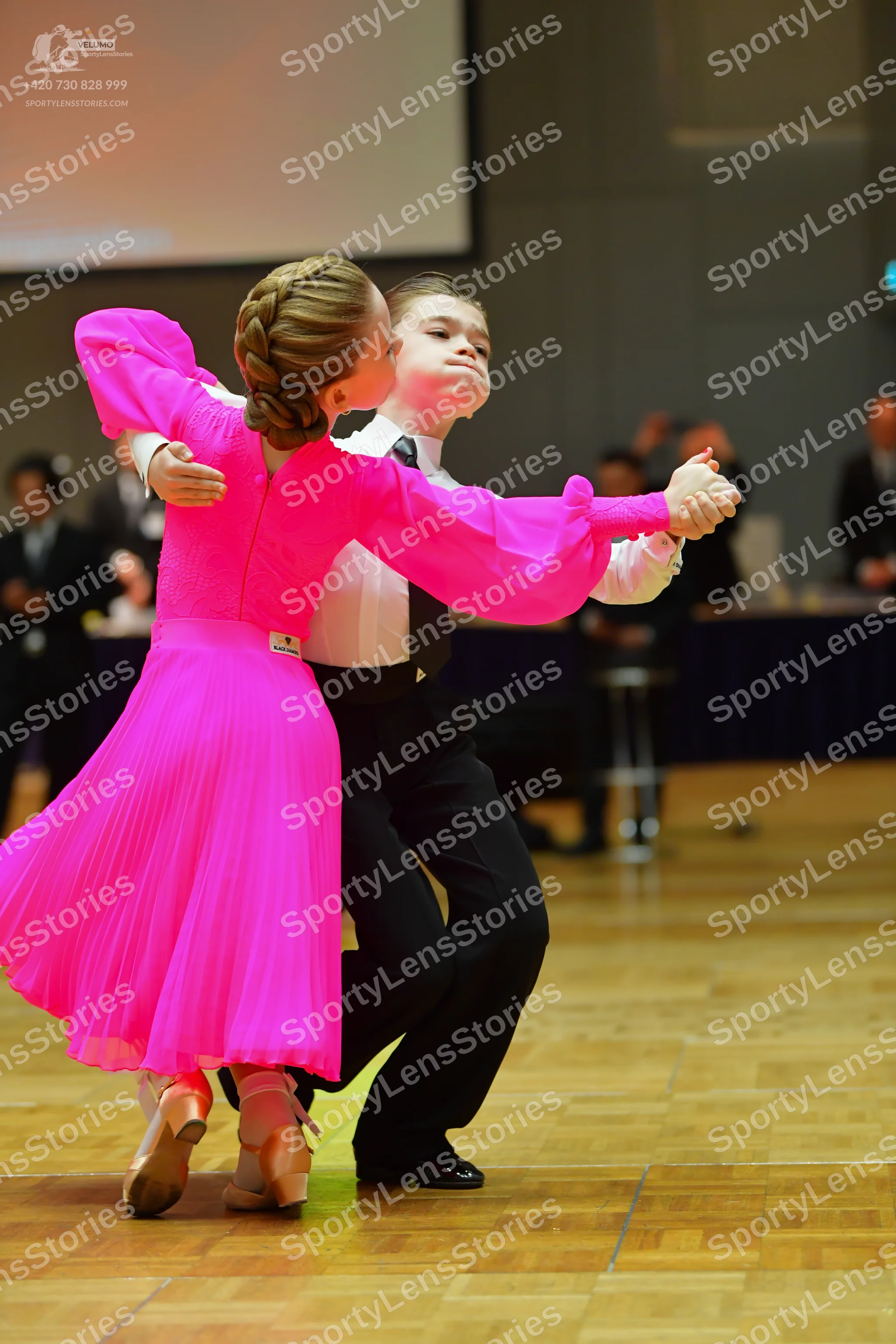 Dancesport competitor: Male dancer: white long-sleeved shirt, black necktie, and black trousers