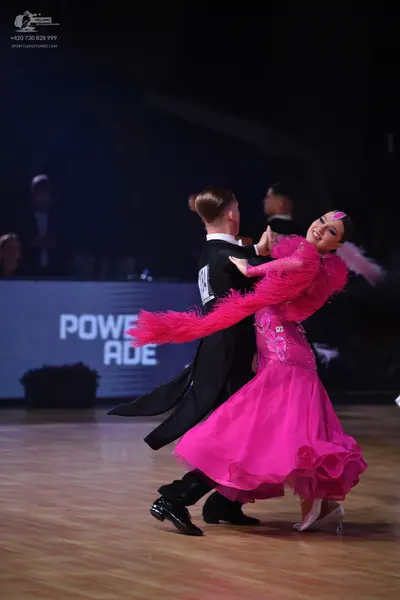 Dancesport competitor: Male dancer: black suit