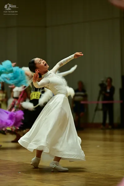 Dancesport competitor: ** White Latin dress
