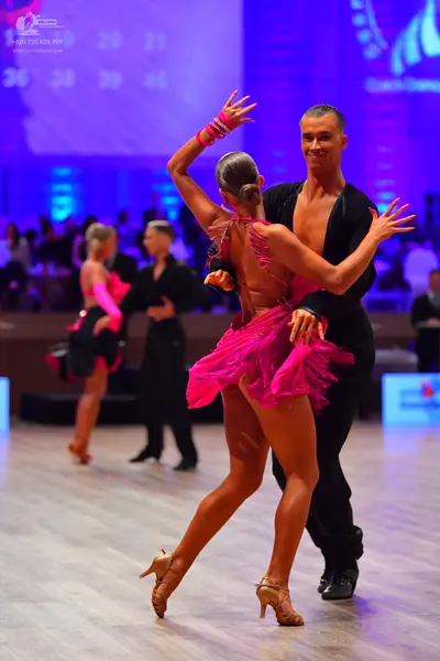 Dancesport competitor: Male dancers: black Latin dance shirts and trousers