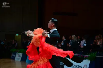 Dancesport competitor: Male dancer: black suit with a white shirt