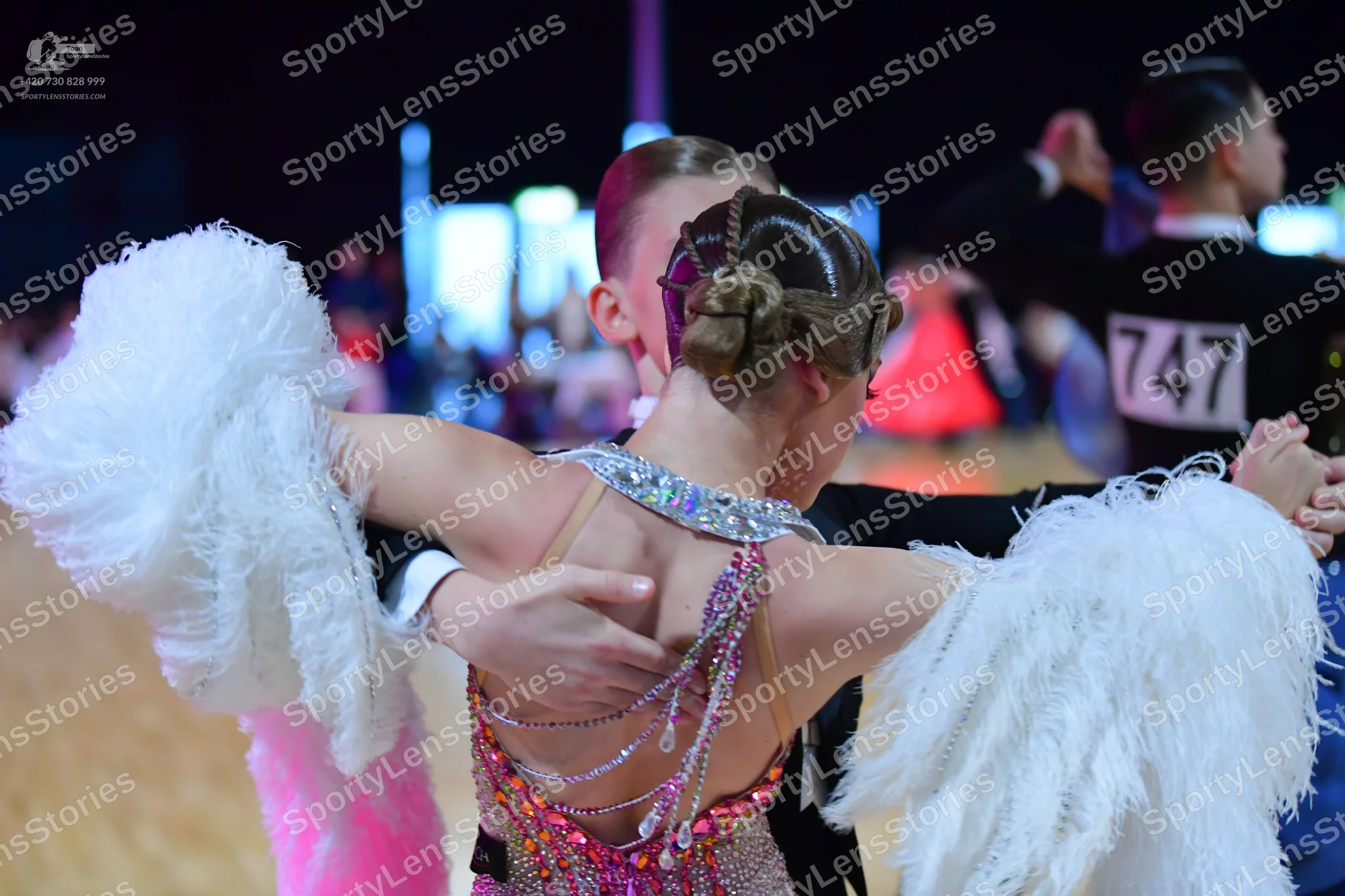 Dancesport competitor #747: Female dancer: pink/lavender ballroom dress adorned with sequins and crystals, f