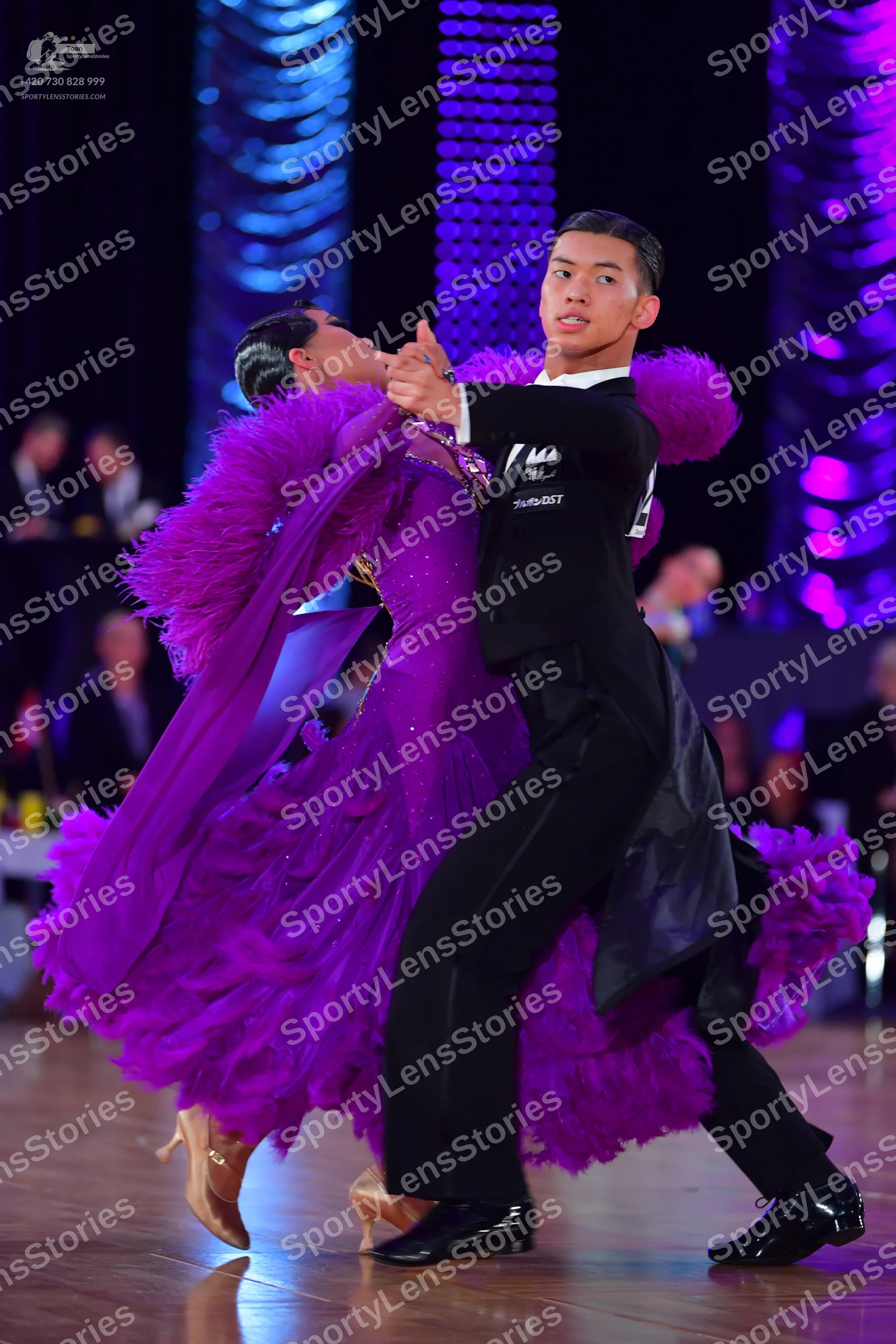 Dancesport competitor: Male dancer: black suit with black trousers and black dance shoes