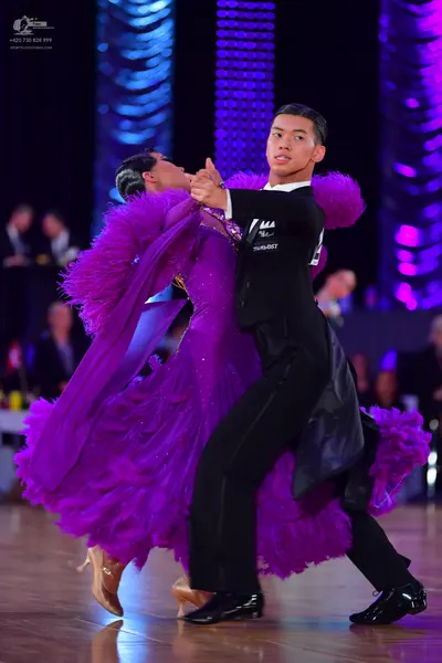 Dancesport competitor: Male dancer: black suit with black trousers and black dance shoes