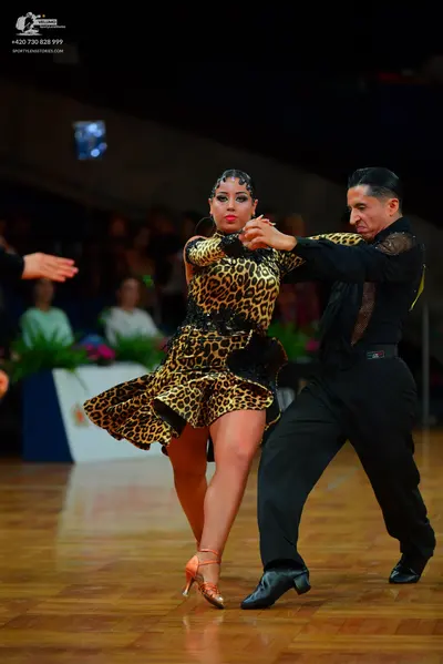 Dancesport competitor: Female dancer: leopard print latin dress with a flared skirt