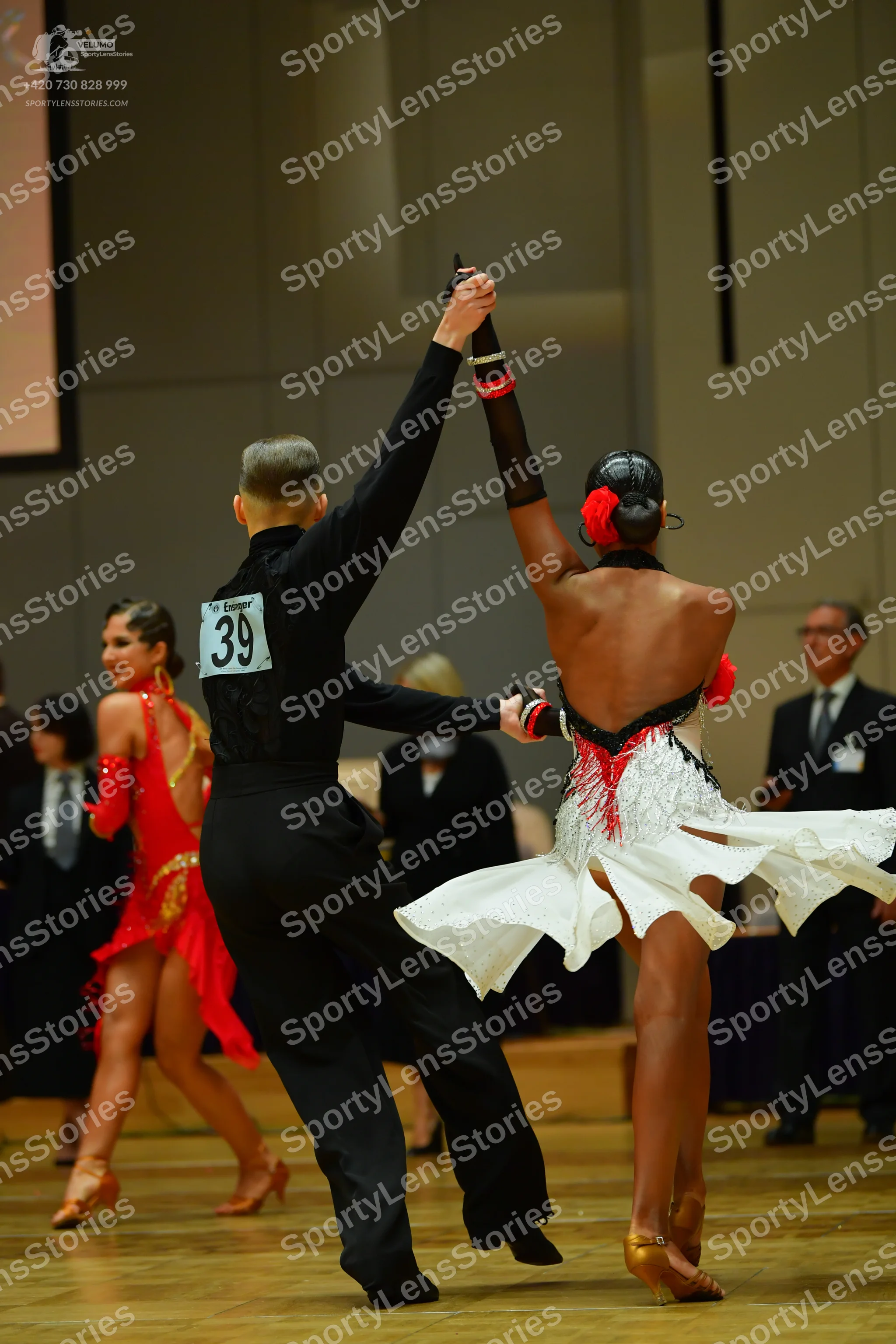 Dancesport competitor: Male dancer: black long-sleeved shirt and black trousers