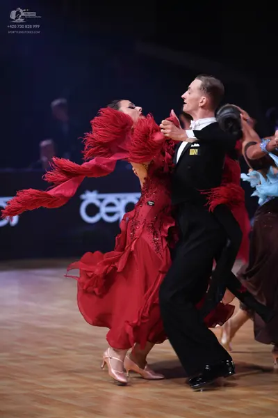 Dancesport competitor: Male dancer: black suit with a white shirt