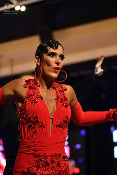 Dancesport competitor: Female**

*   **Color:** Primarily red