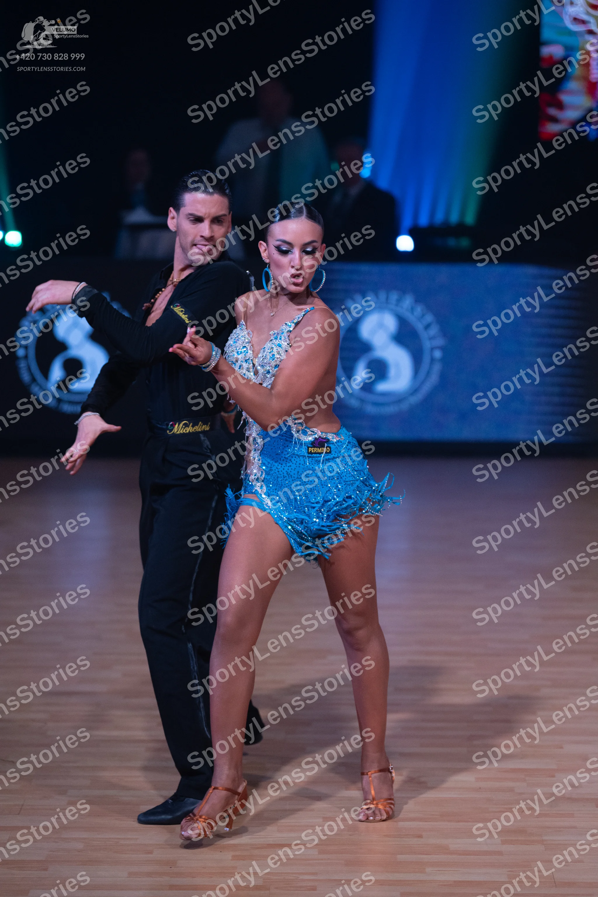 Dancesport competitor: Male dancer: black long-sleeved shirt and black trousers
