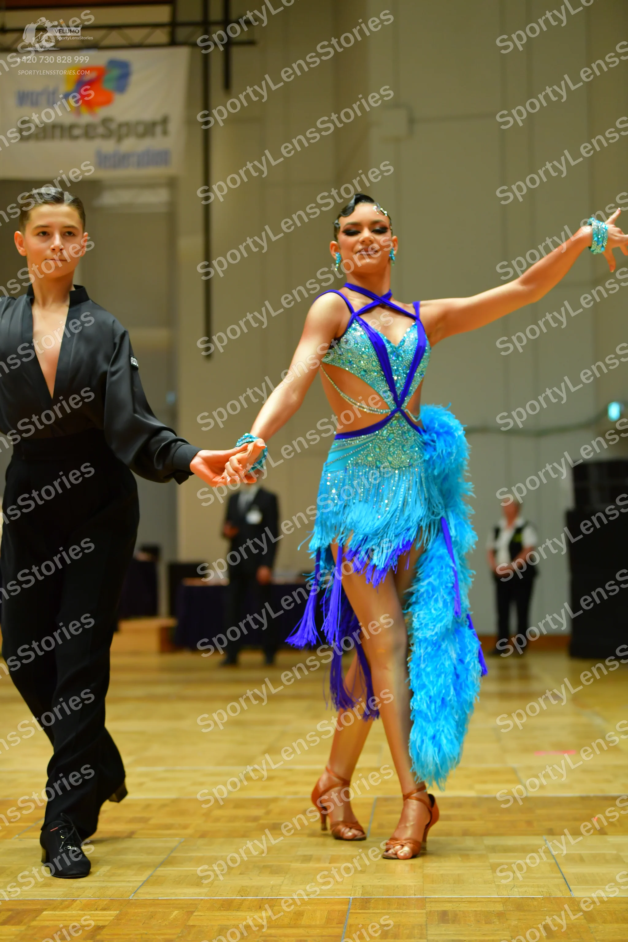 Dancesport competitor: Male dancer: black long-sleeved Latin dance shirt and black trousers