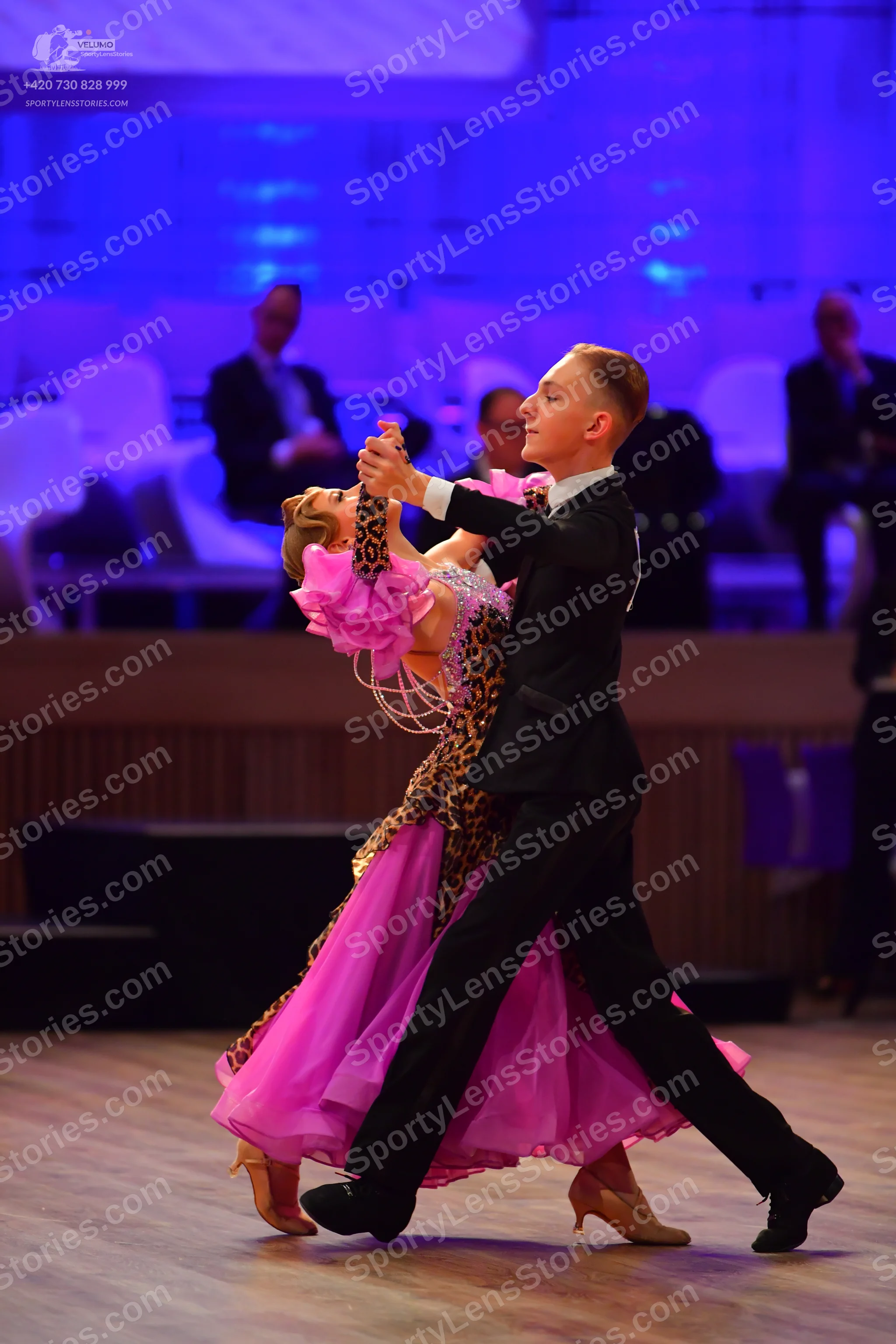 Dancesport competitor: Male dancer: black suit with a white shirt