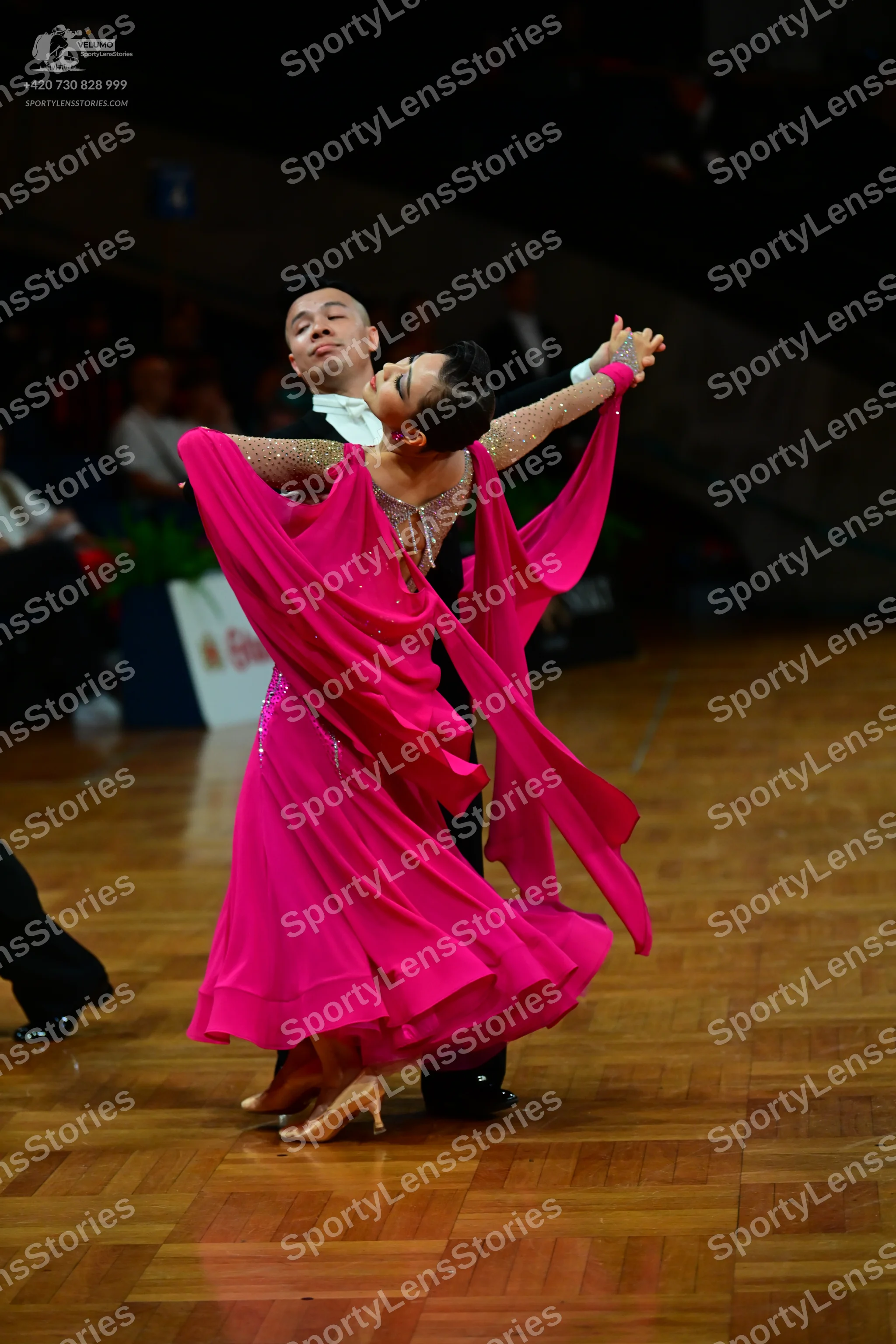 Dancesport competitor: Male dancer: black suit with a white shirt and white bow tie