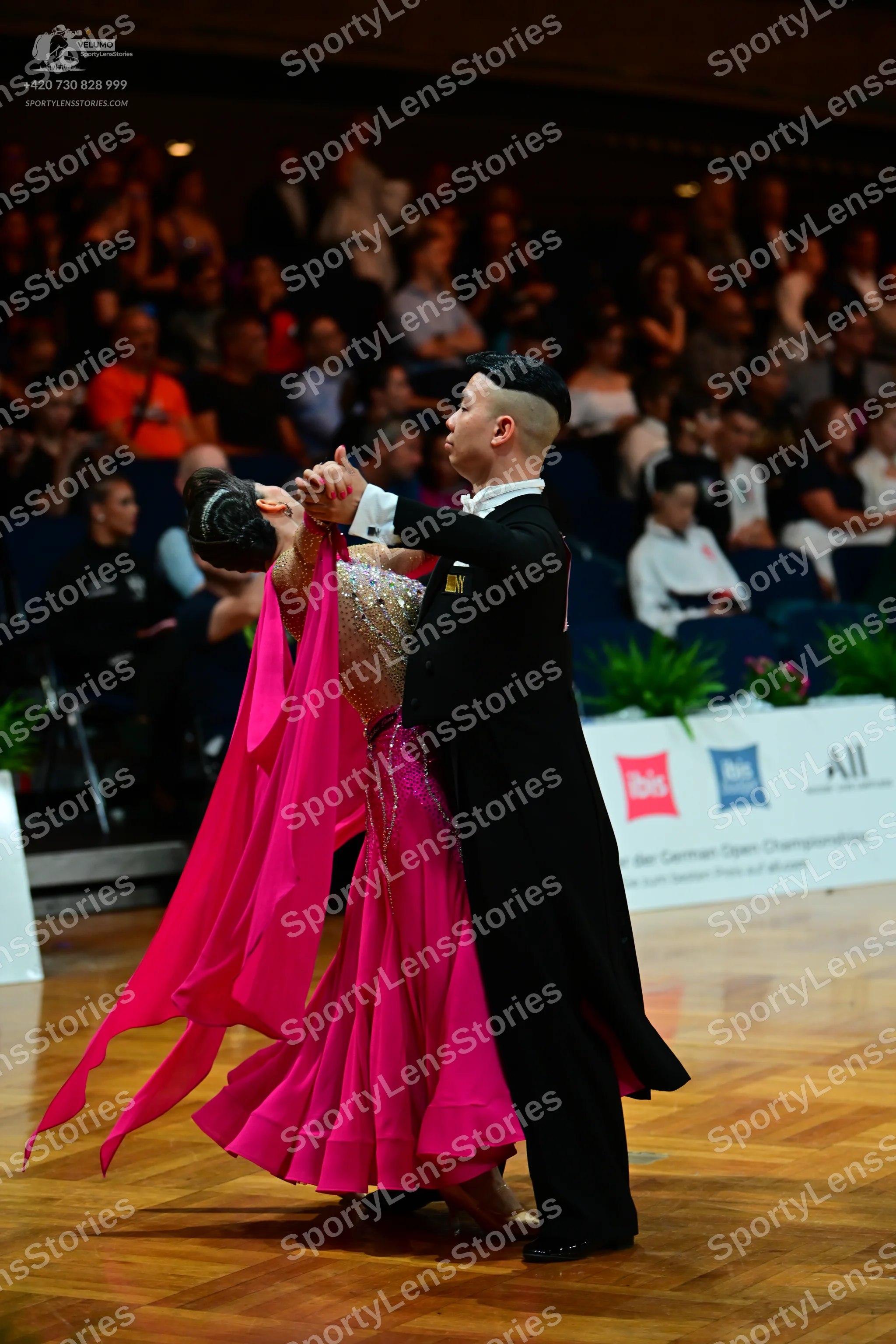 Dancesport competitor: Male dancer: black formal suit with a white shirt