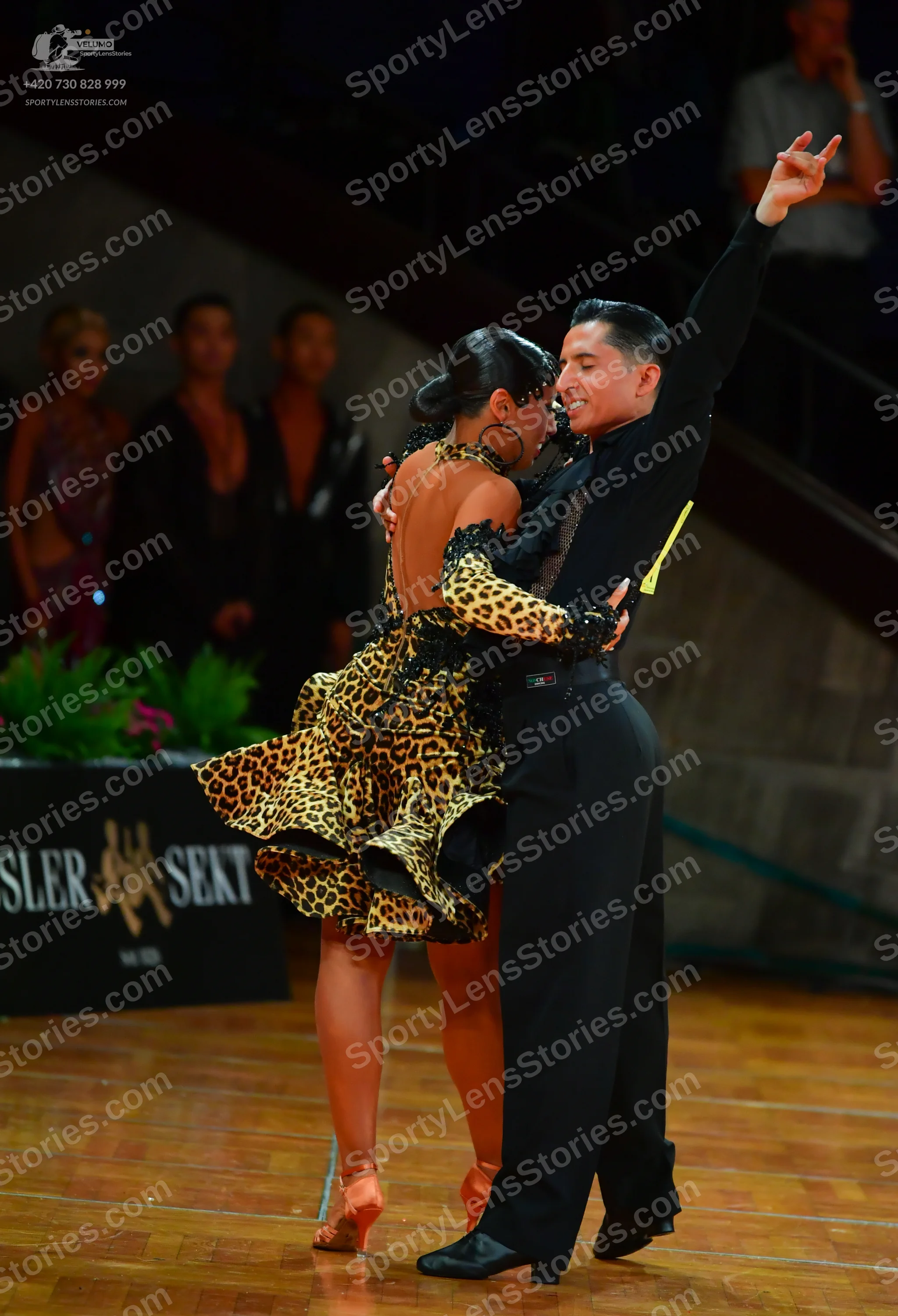 Dancesport competitor: Male dancer: black long-sleeved shirt and black trousers
