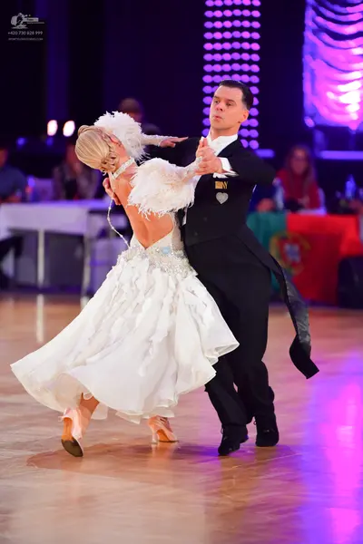 Dancesport competitor: Male dancer: black formal tailcoat with a white shirt and black bow tie
