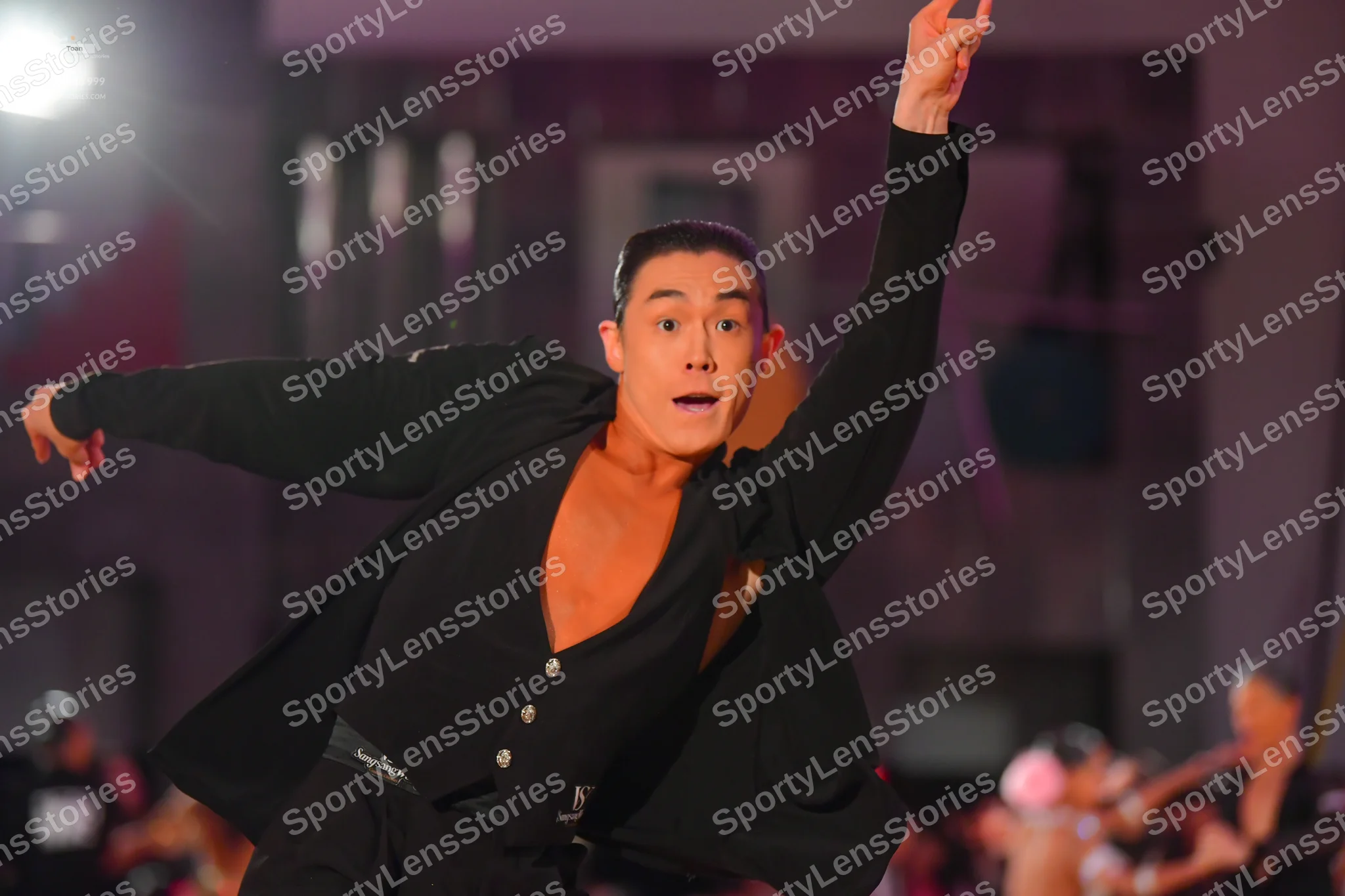 Dancesport competitor: Male dancer: black long-sleeved top, unbuttoned at the chest, with black trouser