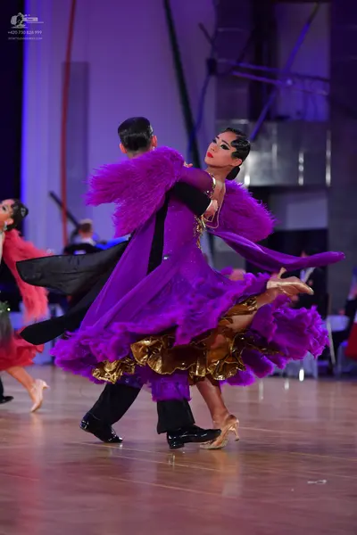 Dancesport competitor: Male dancer: black suit and trousers