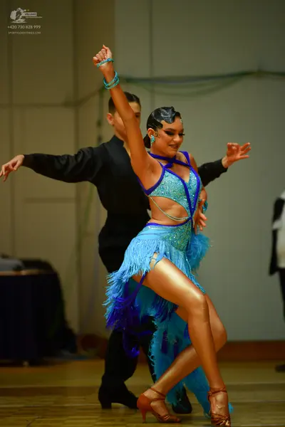 Dancesport competitor: Male dancer: black long-sleeved shirt and trousers