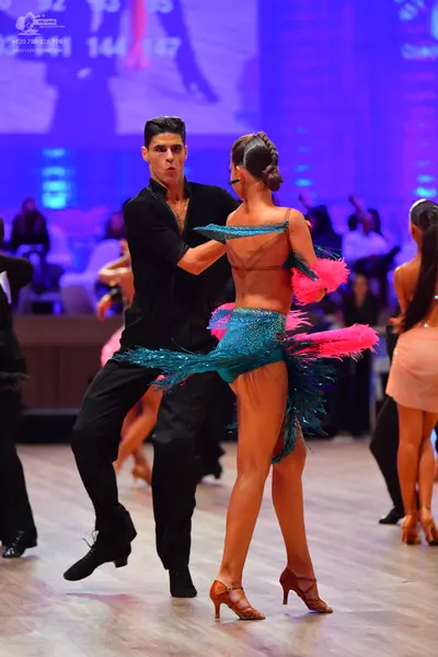 Dancesport competitor: Male dancer: black long-sleeved shirt and black trousers