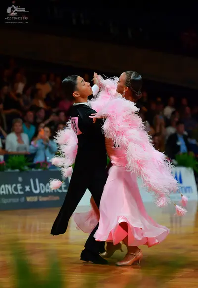 Dancesport competitor: Male dancer: black dance suit with a white shirt