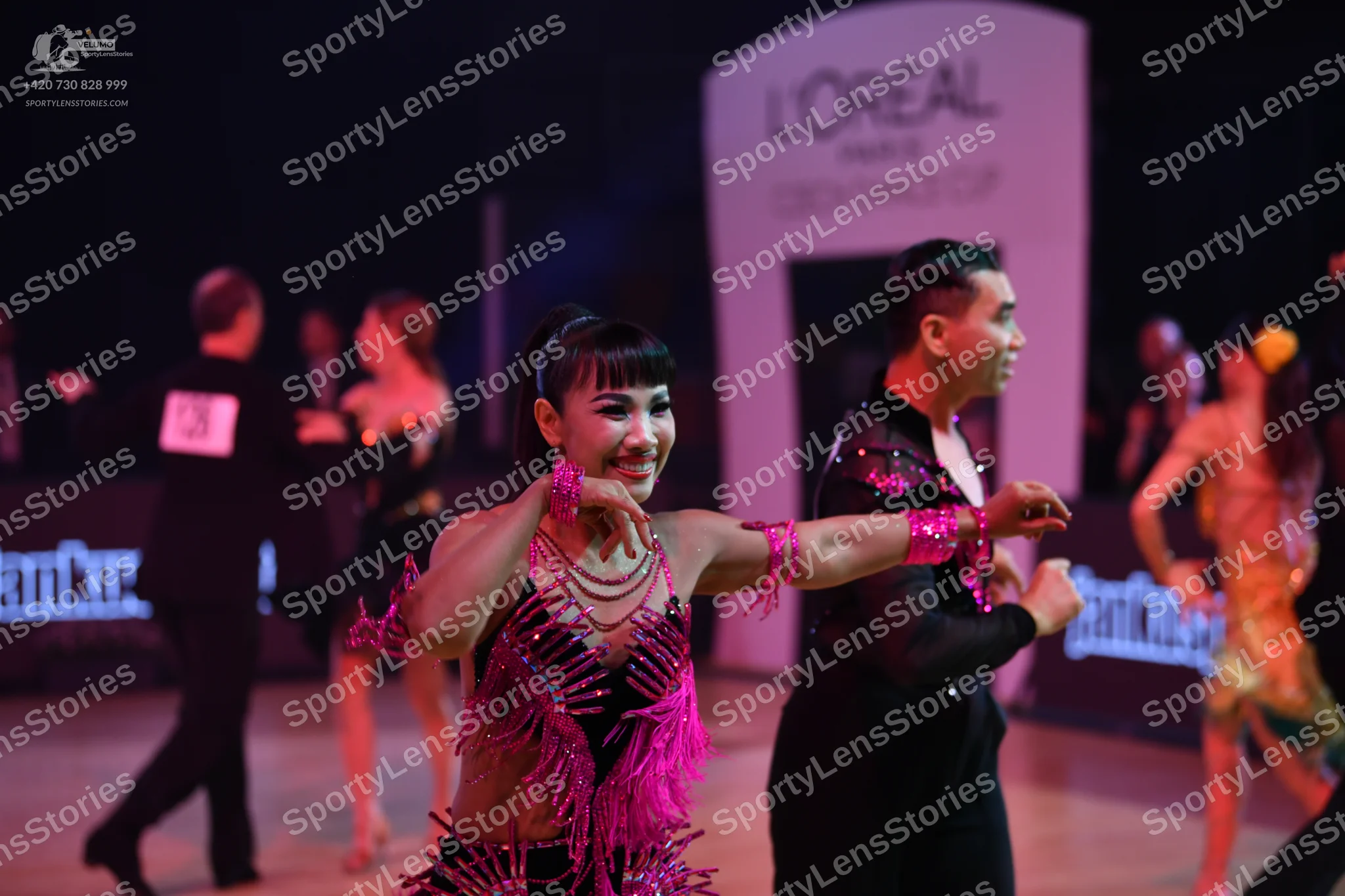 Dancesport competitor: Male dancer (left): black suit