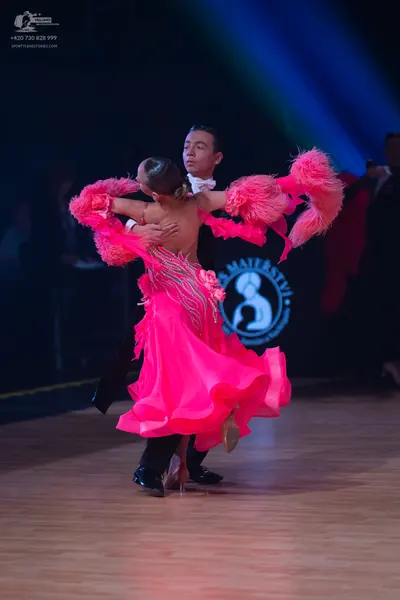 Dancesport competitor: Male dancer: black suit and white shirt