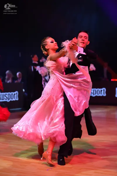 Dancesport competitor: Male dancer: black waistcoat, black trousers, white shirt, and black bow tie