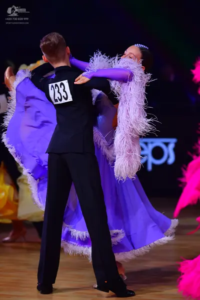 Dancesport competitor: Male dancer: black suit