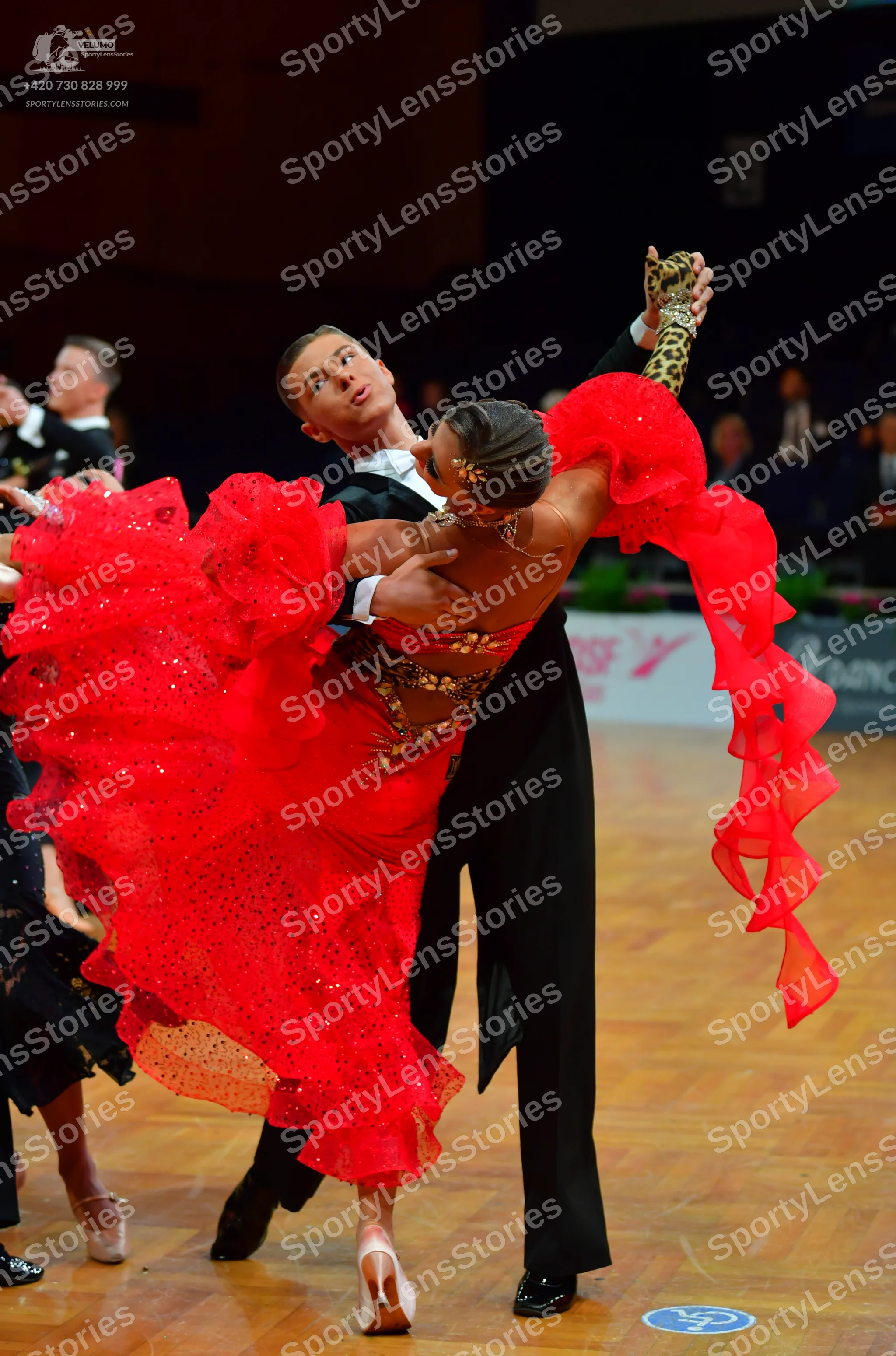 Dancesport competitor: Male dancer: black formal suit with a white shirt and black bow tie