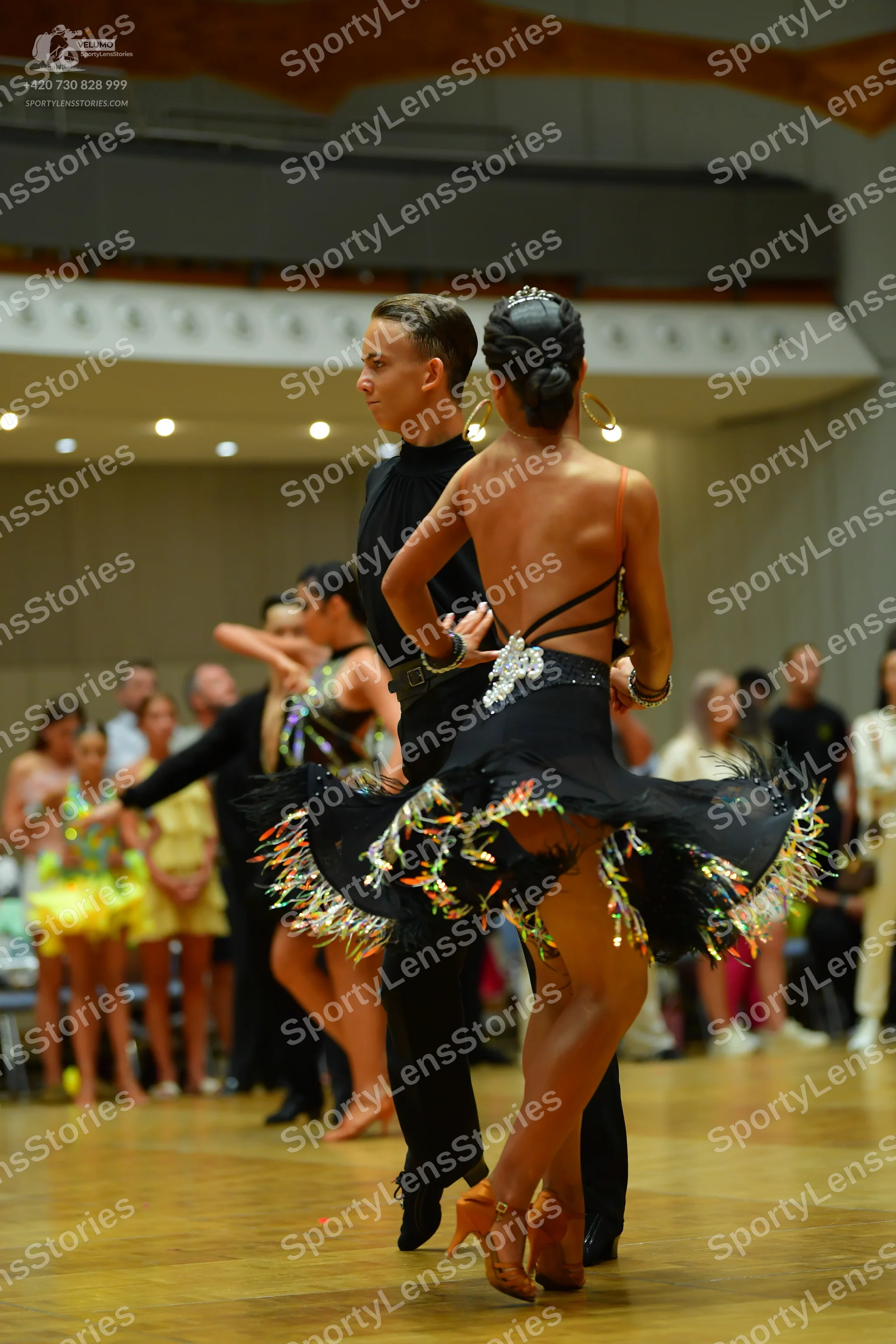 Dancesport competitor: Male dancer: black long-sleeved shirt and black trousers