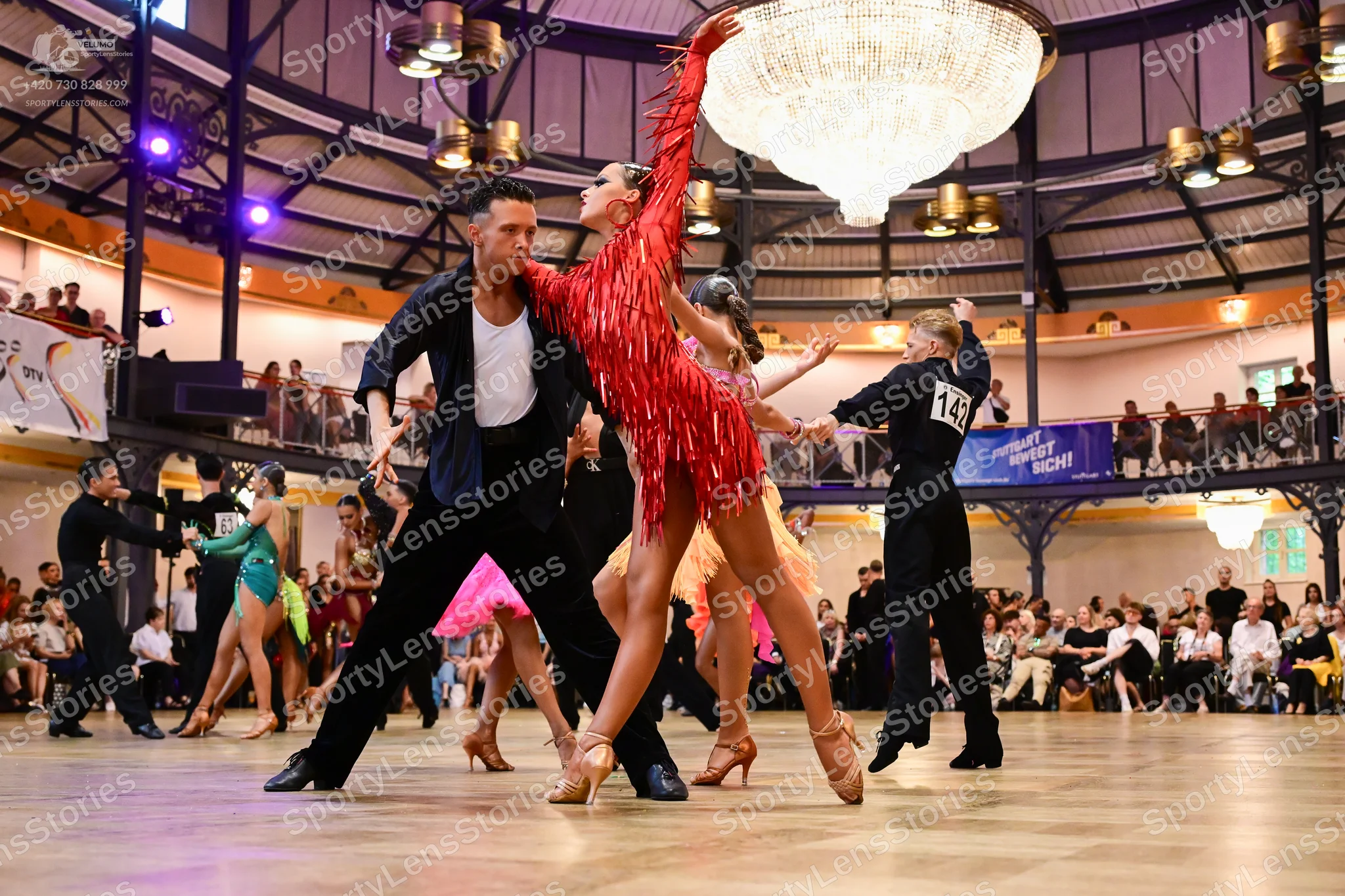 Dancesport competitor #145: Male dancer (center-left): black jacket, white shirt, and black trousers
