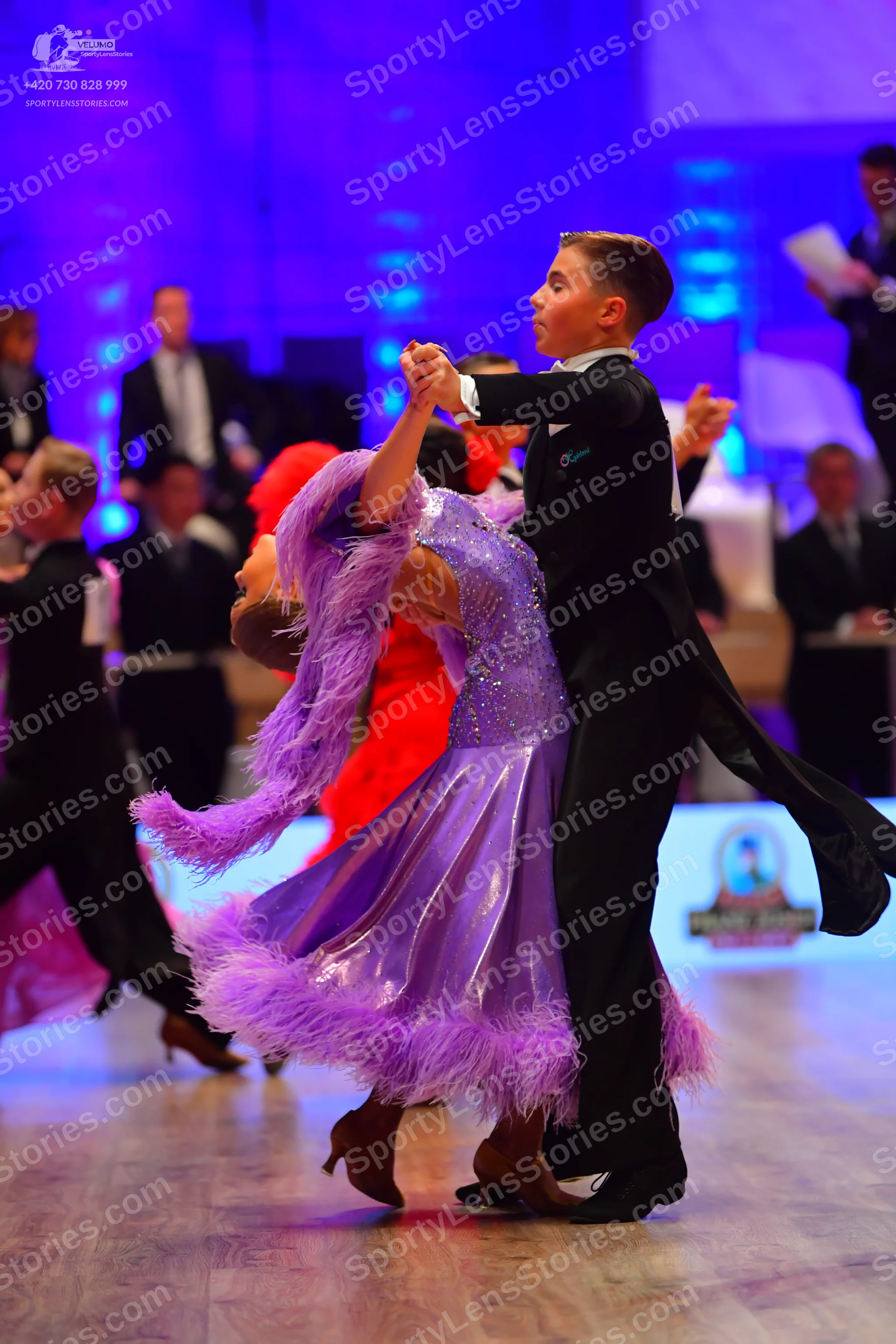 Dancesport competitor: Male dancers: black suits with white shirts