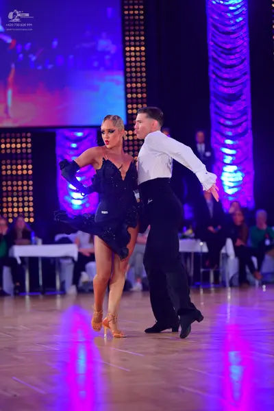 Dancesport competitor: Male dancer: white long-sleeved shirt and black trousers