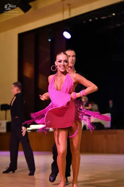 Dancesport competitor: ** Red Latin dress