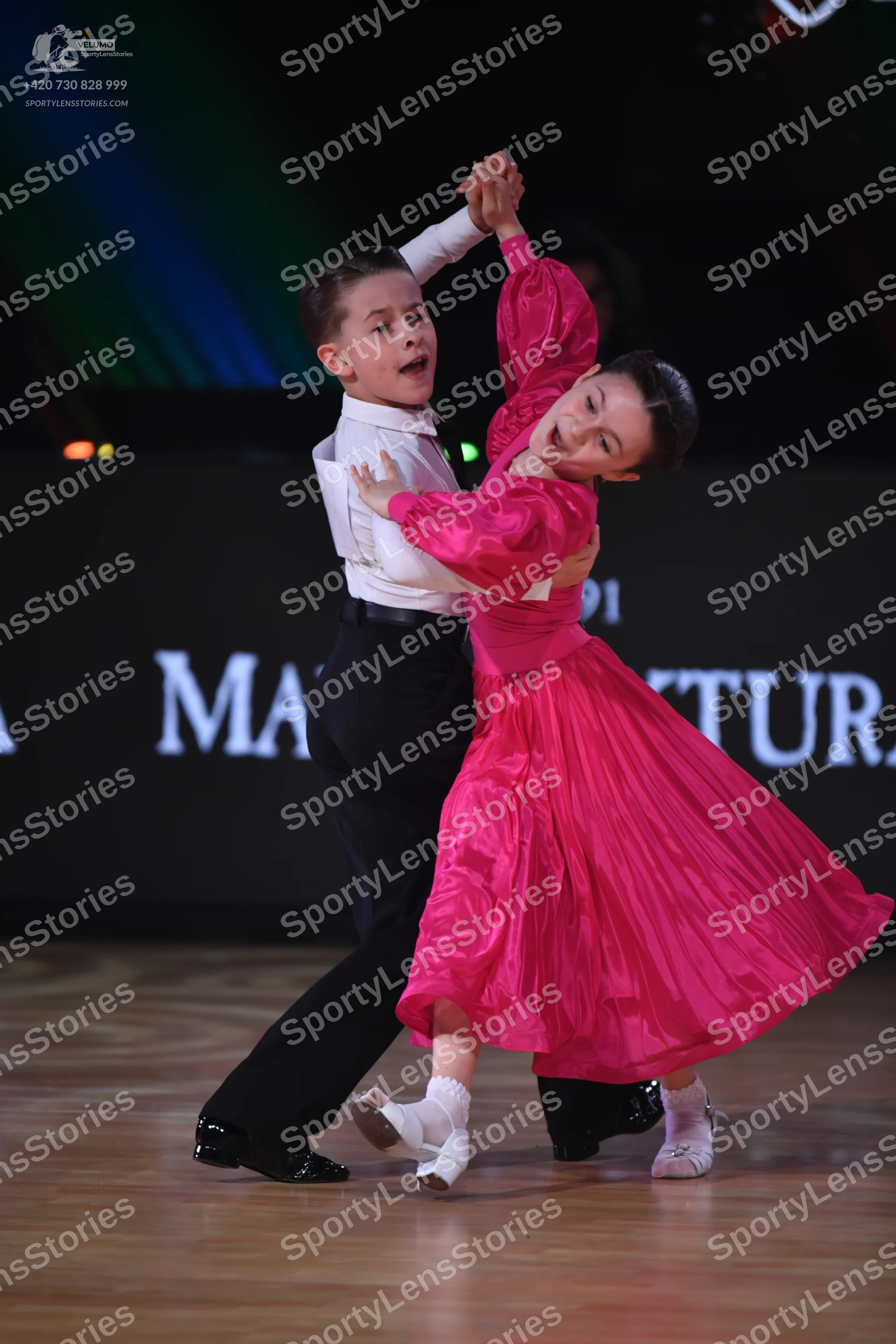 Dancesport competitor: Male dancer: white long-sleeved shirt and black trousers