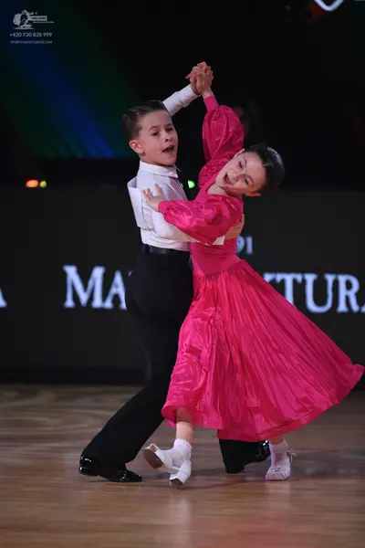 Dancesport competitor: Male dancer: white long-sleeved shirt and black trousers
