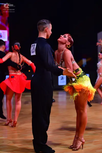 Dancesport competitor: Male dancer: black long-sleeved dance shirt and black trousers
