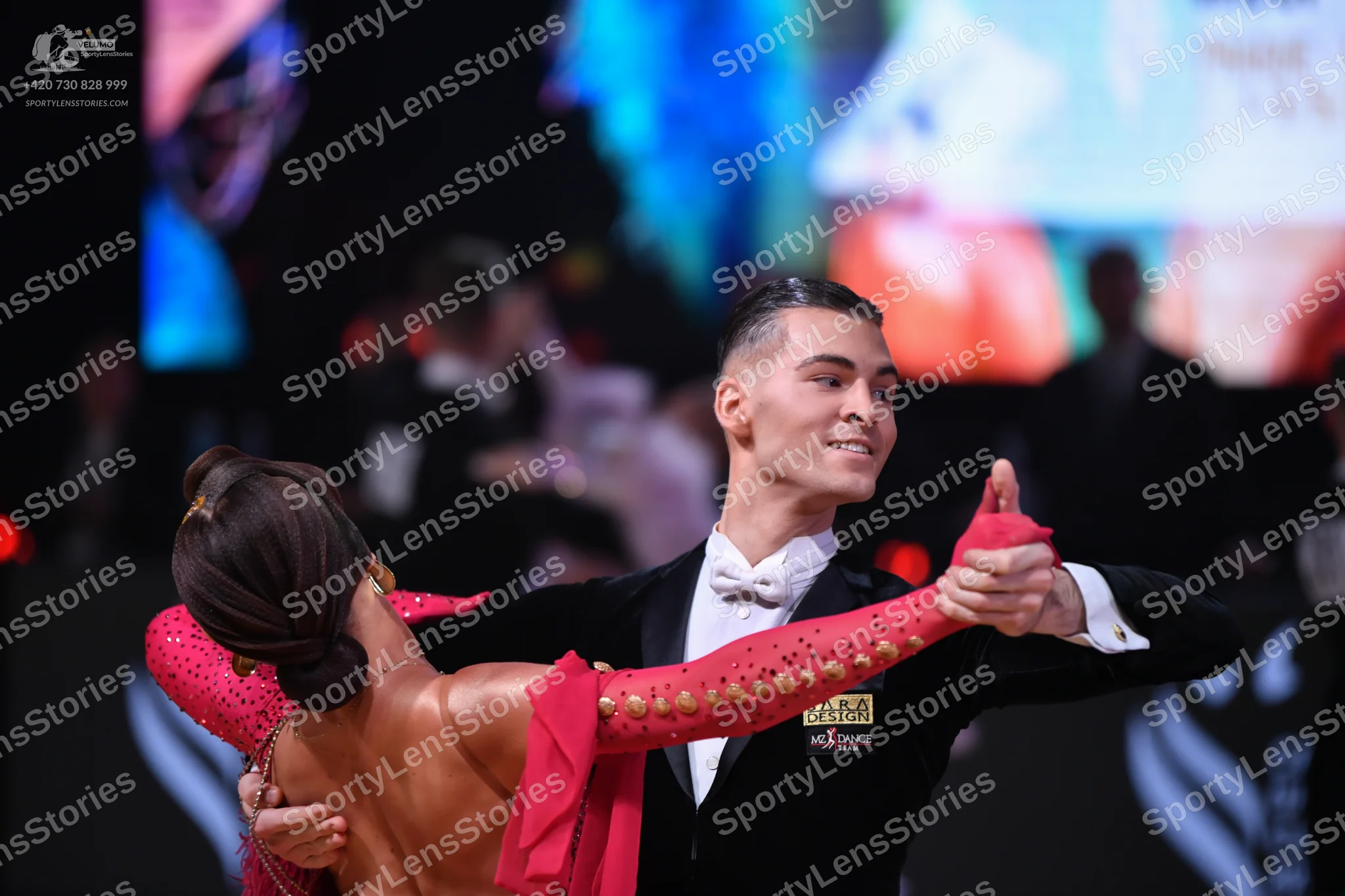 Dancesport competitor: Male dancer: black suit with white shirt and white bowtie