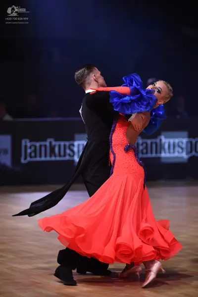 Dancesport competitor: Male dancer: black ballroom tailcoat with a white shirt