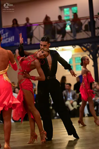 Dancesport competitor: Male dancer: black long-sleeved shirt and black trousers